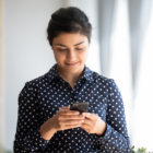 female worker using hosted voip on mobile phone