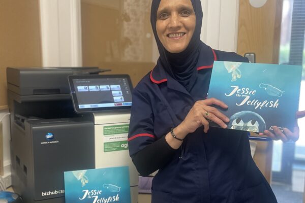 Sabina from Rainbows Nursery in Burbage, Manchester with their refurbished device and copy of Jessie the Jellyfish.