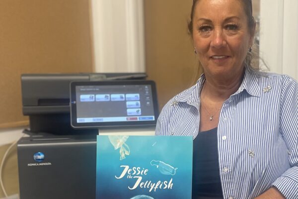 Diane from Rainbows Nursery in Kingsway, Burbage, Manchester with their refurbished device and copy of Jessie the Jellyfish.